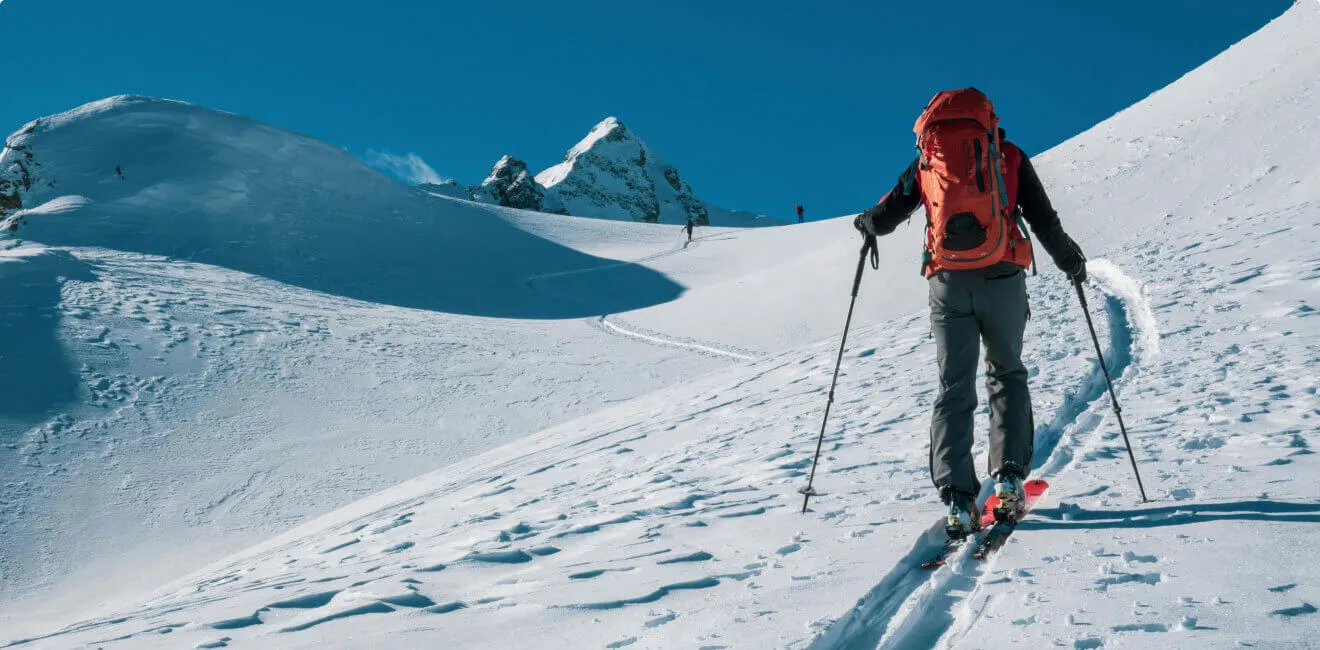 High mountain alpine ridge expedition with sweeping views of glaciated Himalayan peaks