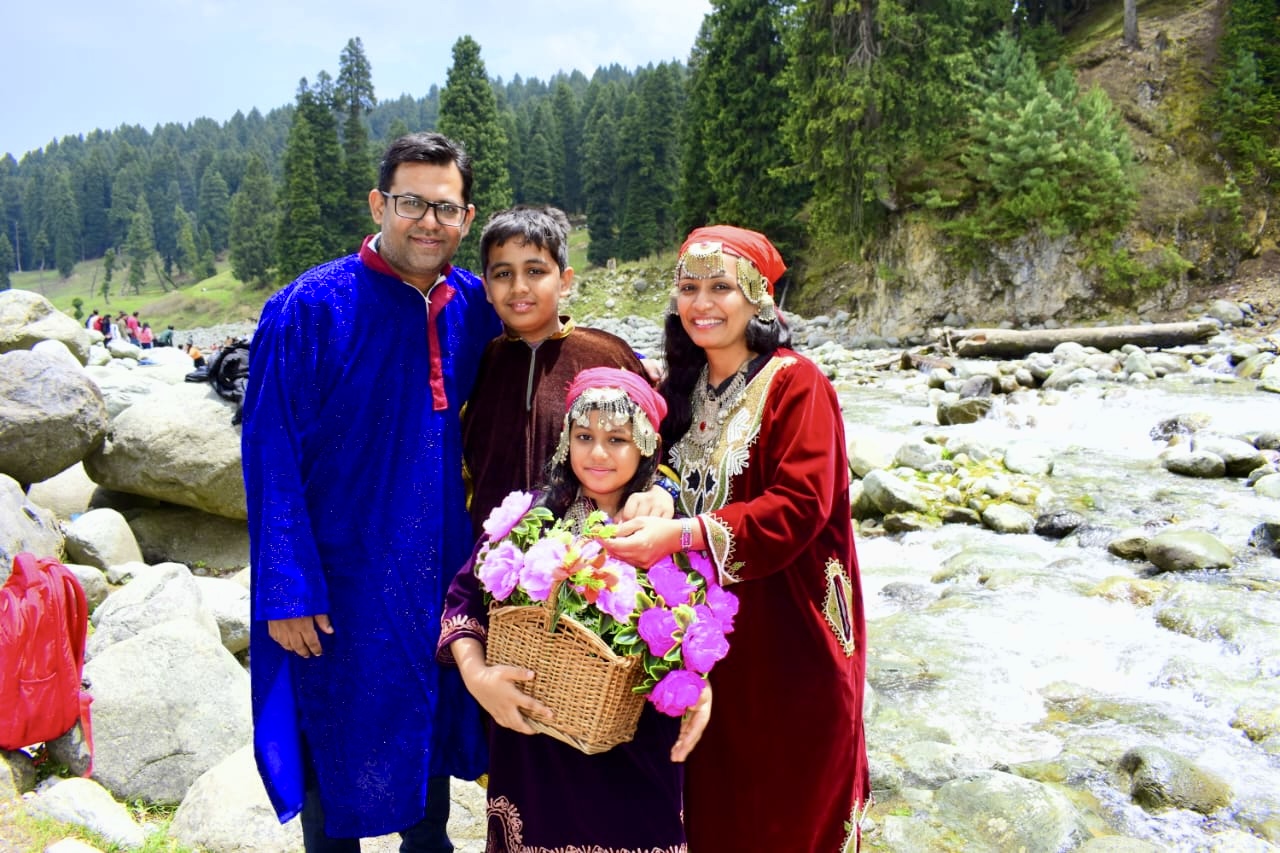 Horseback ride through lush pine forests and alpine meadows in Pahalgam